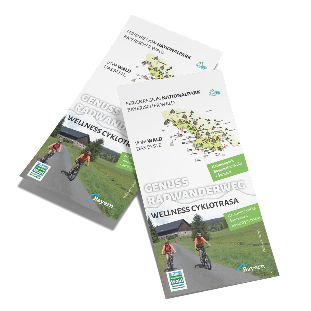 Zwei Radfahrer sind auf den Radkarten "Genuss Radwanderweg" zu sehen auf der böhmischen Seite. 